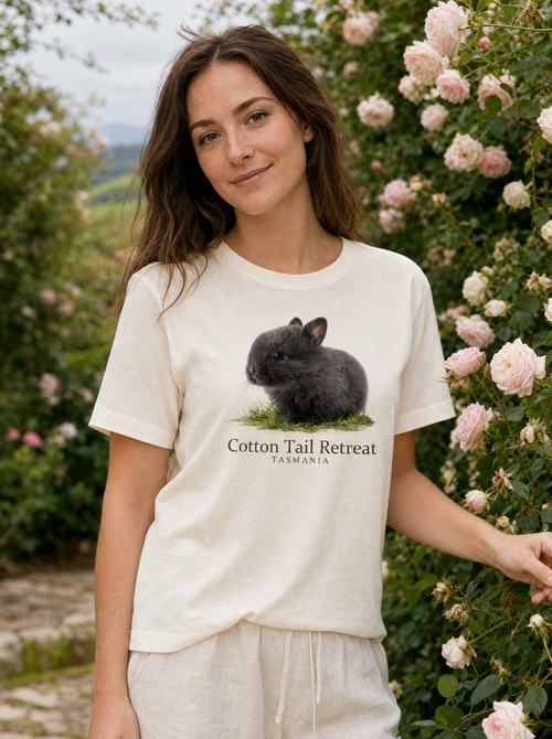 Baby Wombat tee worn by a model in a Tasmanian garden