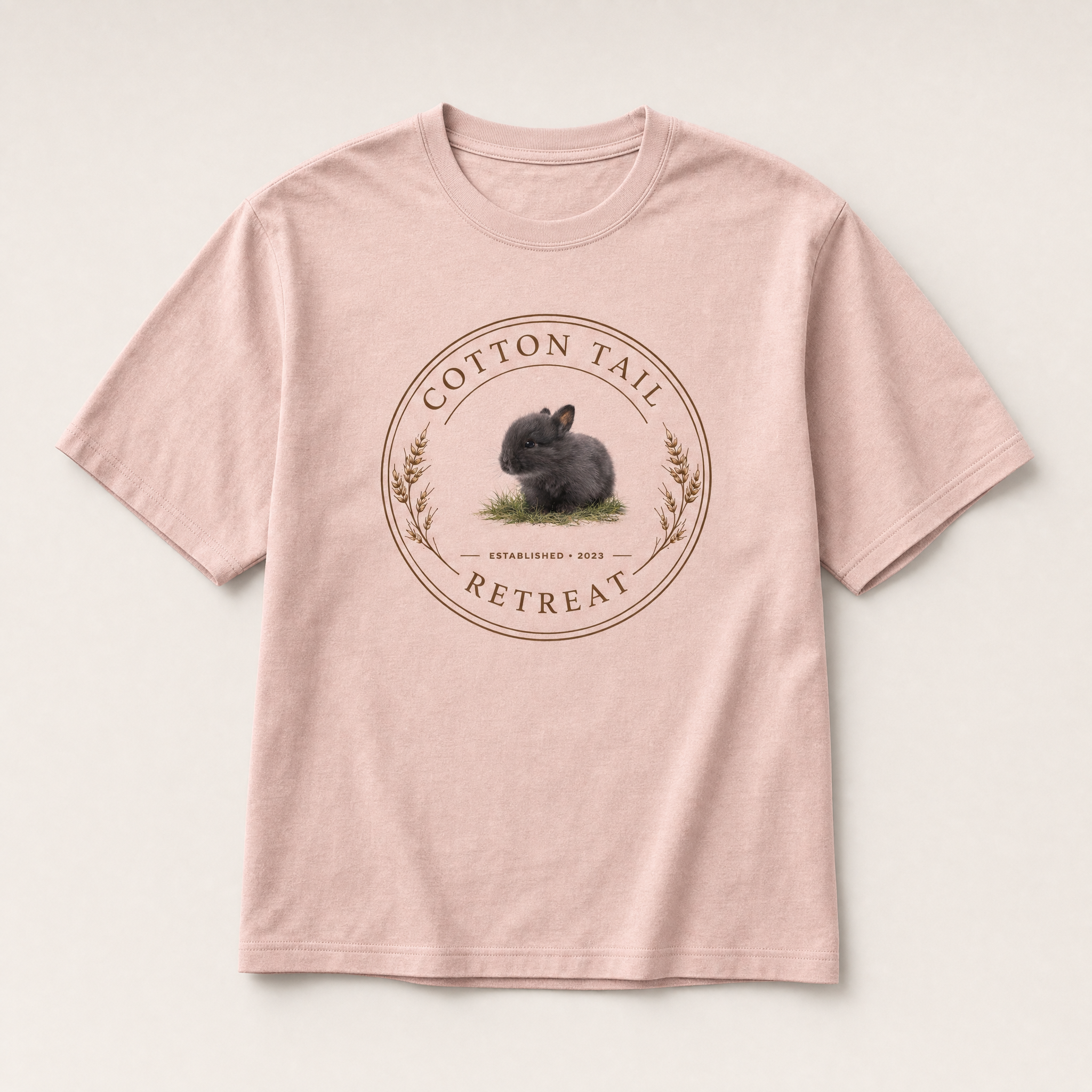 Cotton Tail Retreat logo tee in Pink — studio product shot